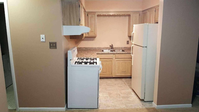 kitchen featuring light brown cabinetry, extractor fan, white appliances, and sink