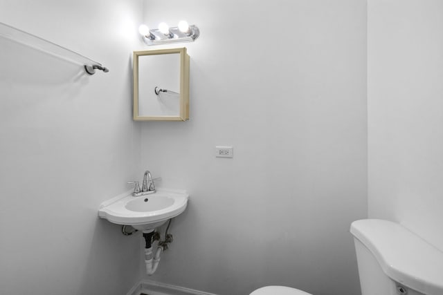 bathroom with toilet and sink