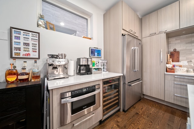 kitchen with stainless steel appliances, wine cooler, light brown cabinets, dark hardwood / wood-style floors, and backsplash