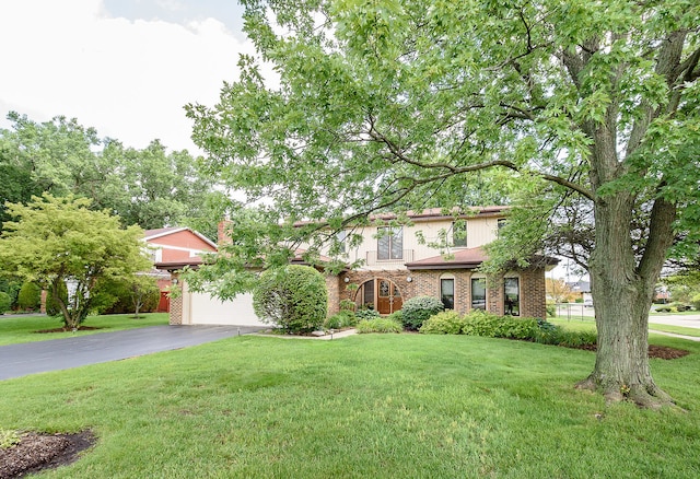 1385 Montgomery Dr, Deerfield, IL 60015 - view of front of property featuring asphalt driveway, a front lawn, brick siding, and a garage