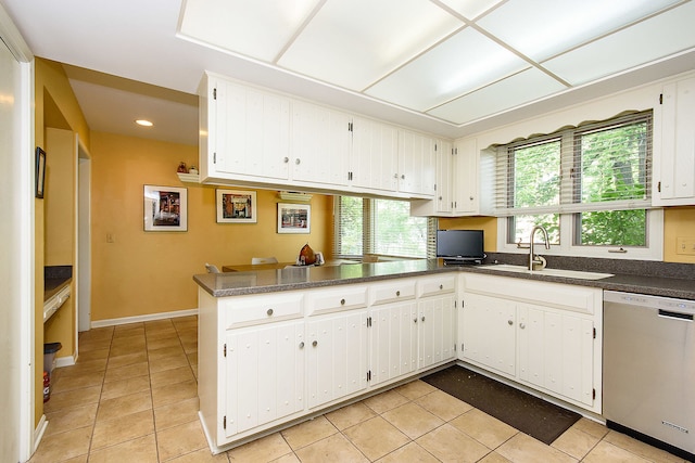 1385 Montgomery Dr, Deerfield, IL 60015 - kitchen featuring dishwasher, light tile patterned flooring, dark countertops, white cabinets, and recessed lighting