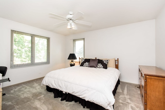 1385 Montgomery Dr, Deerfield, IL 60015 - bedroom with multiple windows, light carpet, and ceiling fan