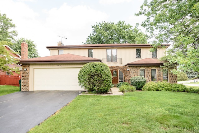 1385 Montgomery Dr, Deerfield, IL 60015 - view of front of property featuring driveway, brick siding, a garage, and a front lawn