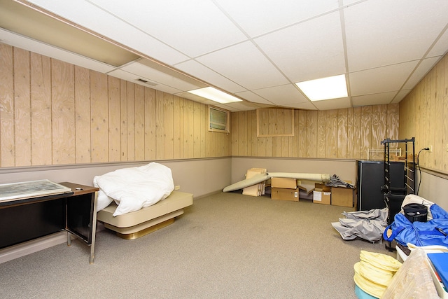 1385 Montgomery Dr, Deerfield, IL 60015 - living area featuring wooden walls, carpet flooring, and a paneled ceiling