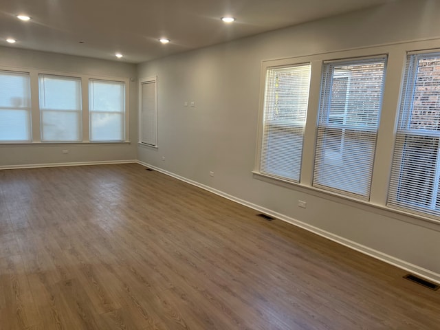 unfurnished room featuring dark hardwood / wood-style floors