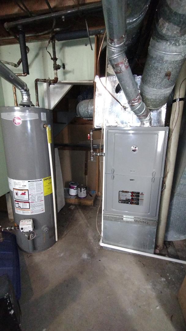 utilities with heating unit and gas water heater