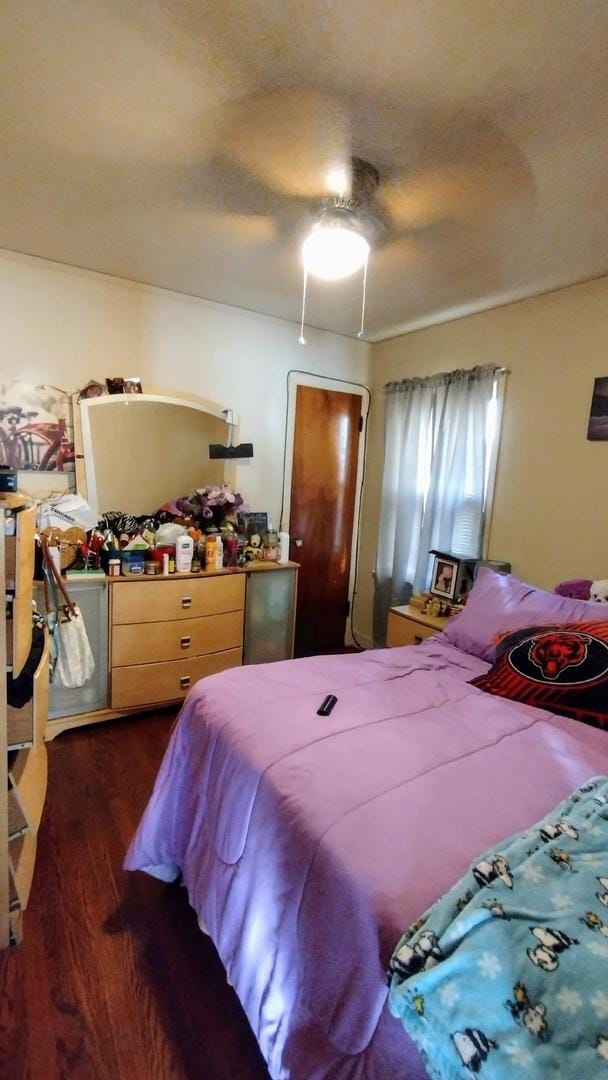 bedroom featuring ceiling fan and dark hardwood / wood-style flooring