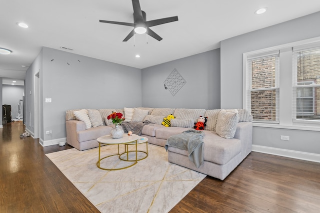 living room featuring dark hardwood / wood-style floors and ceiling fan