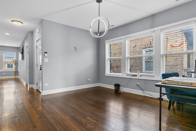 interior space featuring a wealth of natural light and dark hardwood / wood-style flooring