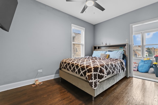 bedroom with ceiling fan and dark wood-type flooring