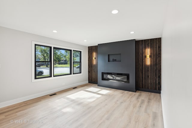 unfurnished living room featuring light hardwood / wood-style floors