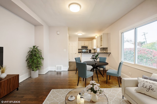 living room with dark hardwood / wood-style floors