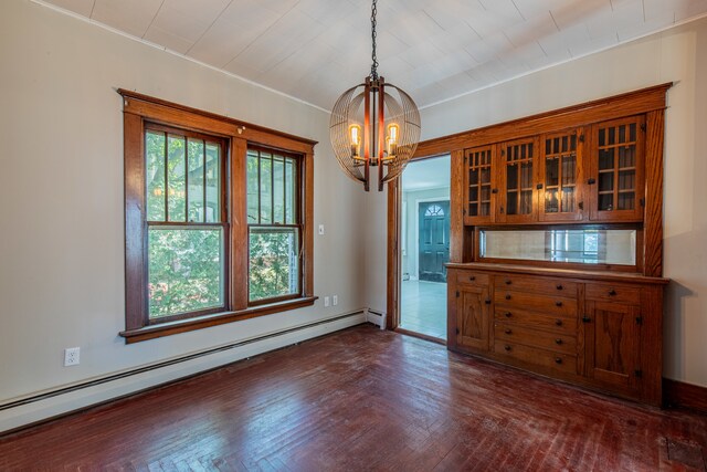 unfurnished dining area with baseboard heating, a chandelier, and dark parquet floors