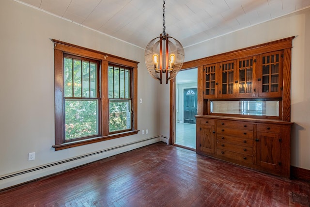 111 E 3rd St, Prophetstown, IL 61277 - unfurnished dining area with a baseboard radiator, a chandelier, and dark wood-style flooring