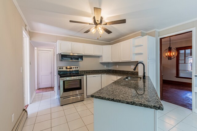 kitchen with stainless steel appliances, light wood-type flooring, pendant lighting, white cabinets, and baseboard heating