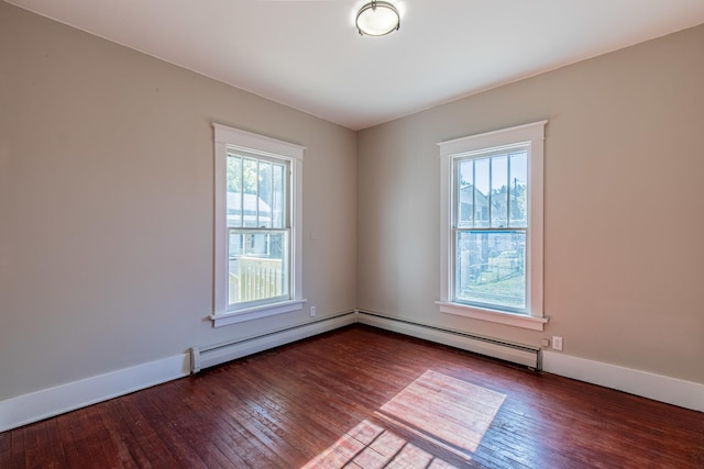 111 E 3rd St, Prophetstown, IL 61277 - spare room with healthy amount of natural light, wood-type flooring, and baseboards