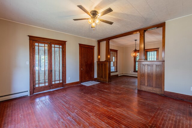 interior space featuring dark wood-type flooring, baseboard heating, french doors, and ceiling fan with notable chandelier