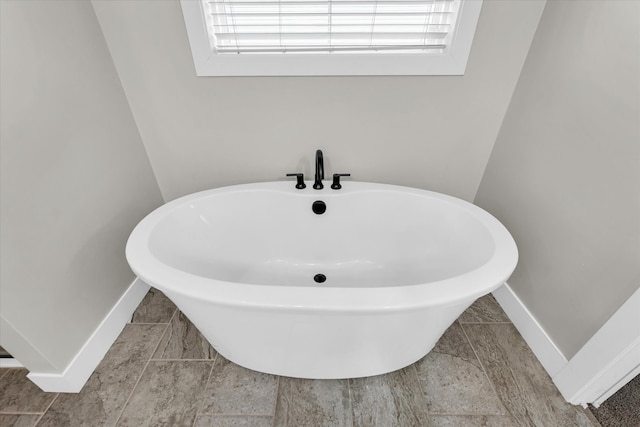 bathroom with a washtub