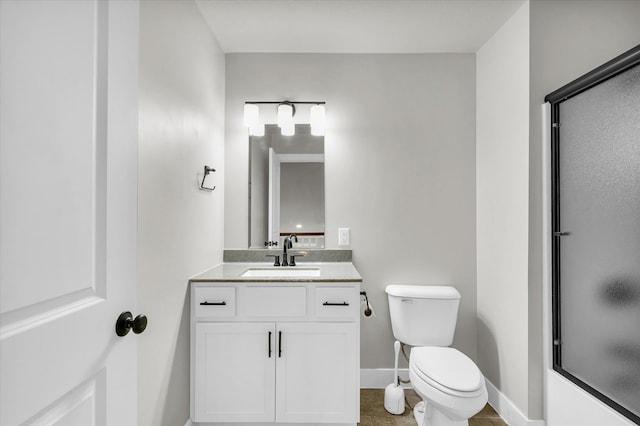 bathroom with toilet and vanity