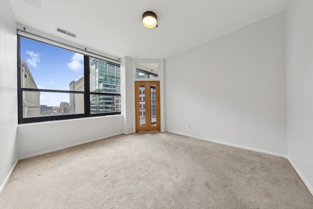 empty room featuring light colored carpet