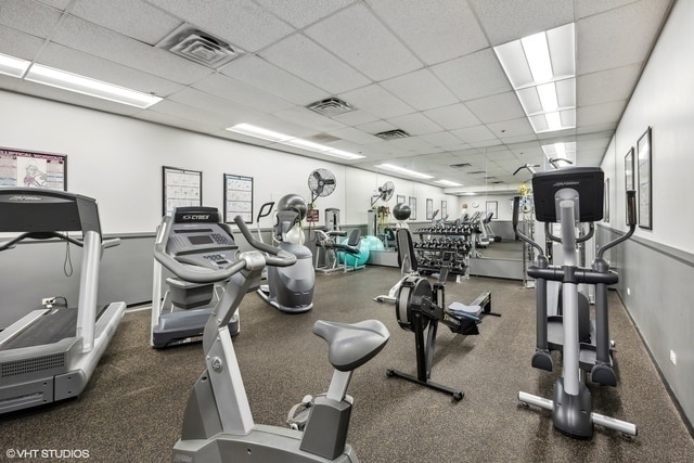 workout area with a drop ceiling