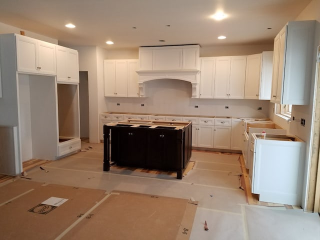 kitchen featuring white cabinets