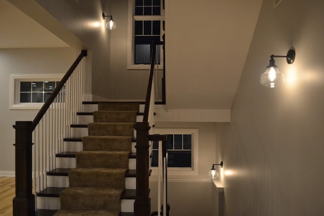 stairs featuring wood-type flooring