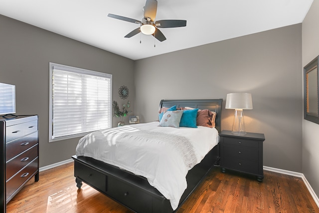 bedroom featuring dark wood-type flooring and ceiling fan