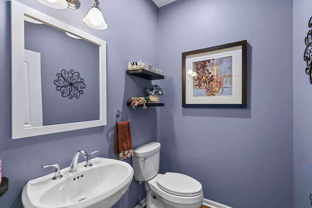 bathroom featuring sink and toilet