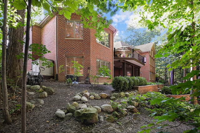 view of home's exterior featuring a balcony