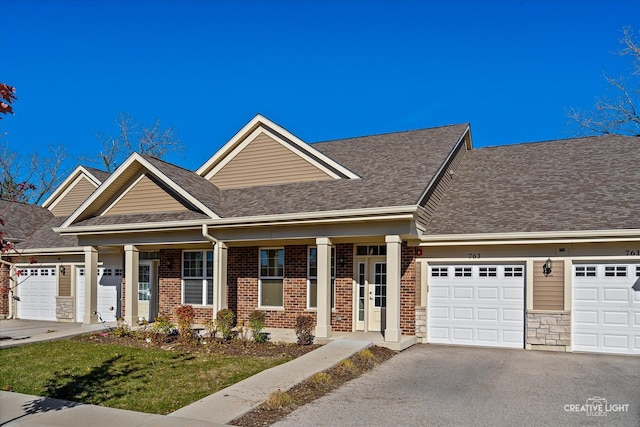 view of front of home with a garage and a porch