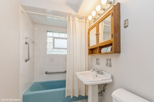 full bathroom with shower / bath combination with curtain, toilet, and sink