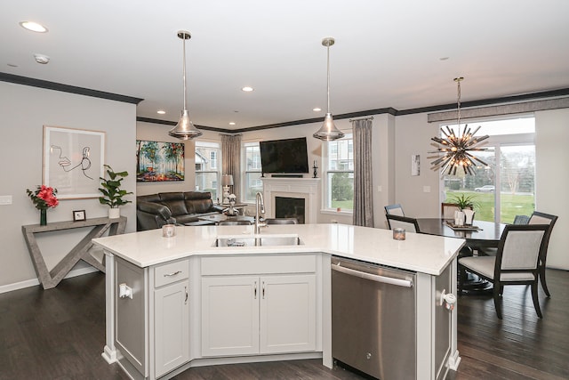 kitchen featuring white cabinetry, a healthy amount of sunlight, a center island with sink, and stainless steel dishwasher