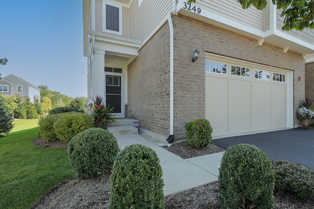 doorway to property featuring a garage