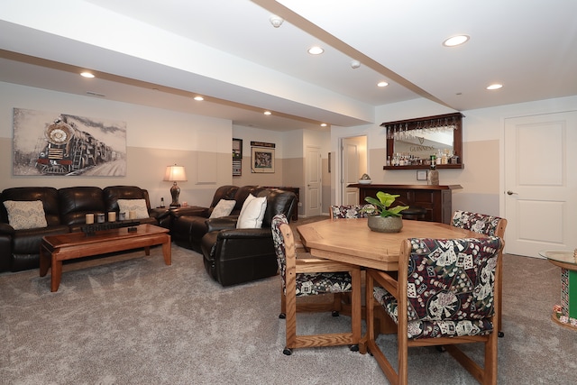 dining room featuring carpet floors and indoor bar