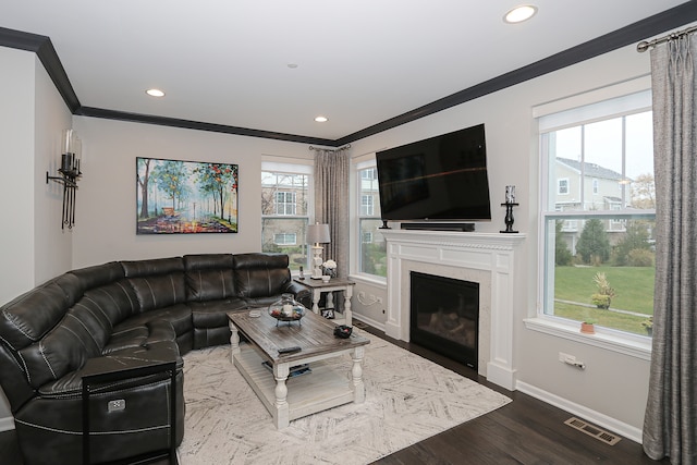 living room with wood-type flooring and ornamental molding