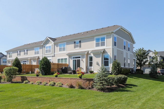 view of front of home with a front yard and central air condition unit