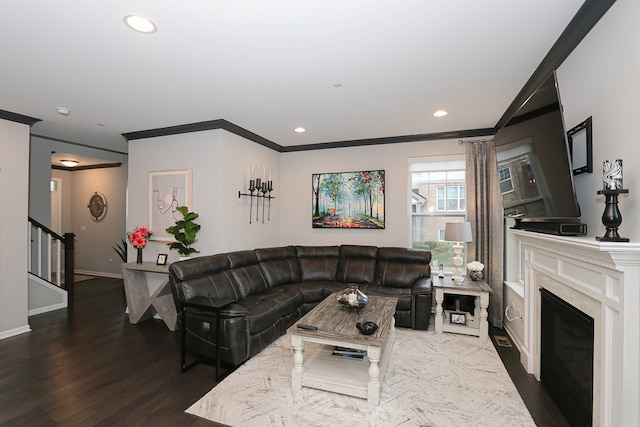 living room with crown molding and dark hardwood / wood-style flooring