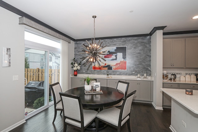 dining area featuring dark hardwood / wood-style flooring, a wealth of natural light, and ornamental molding