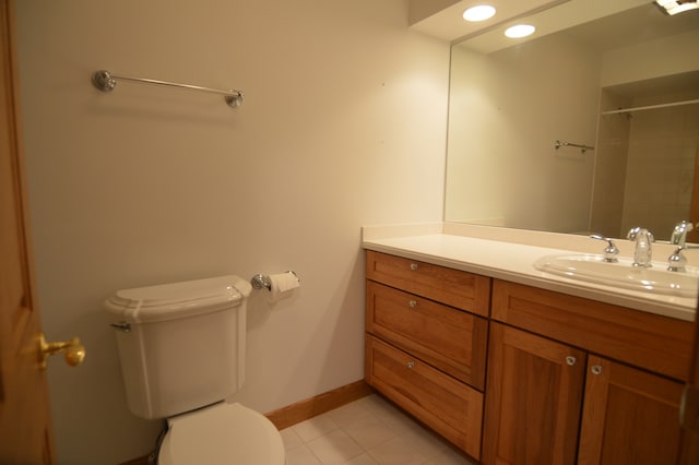 bathroom with vanity, tile patterned floors, and toilet