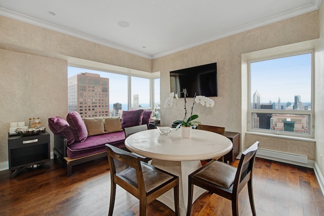 dining space featuring a baseboard radiator, hardwood / wood-style flooring, and crown molding