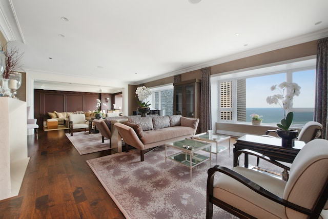 living room with plenty of natural light, a water view, crown molding, and dark hardwood / wood-style flooring