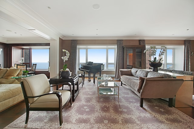 living room with hardwood / wood-style floors, a water view, and crown molding