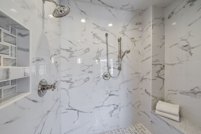 bathroom with a tile shower