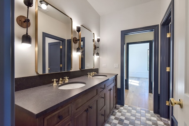 bathroom with hardwood / wood-style flooring and vanity