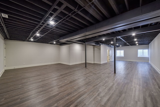 basement with hardwood / wood-style flooring