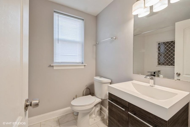 bathroom with tile patterned floors, vanity, and toilet