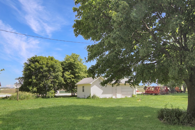 view of yard with a garage