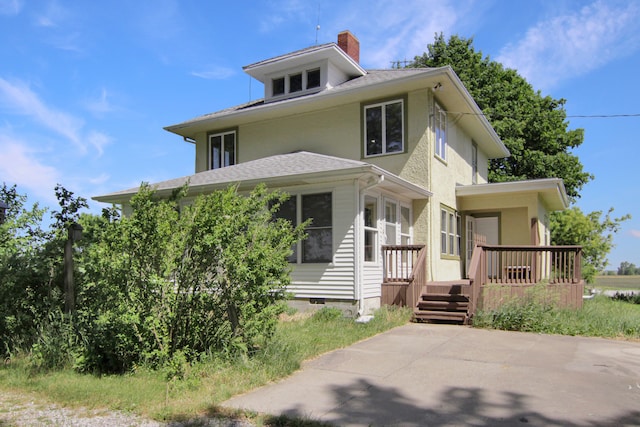 view of front of property featuring a wooden deck