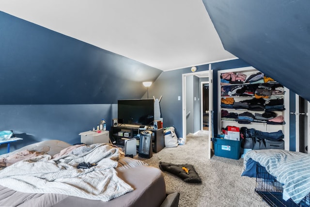 carpeted bedroom featuring lofted ceiling